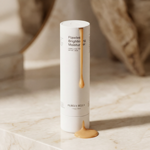 Skincare product with Purely Bella branding on a marble surface