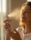 Woman applying cooling mist - nighttime skincare routine bundle astaxanthin women over 40