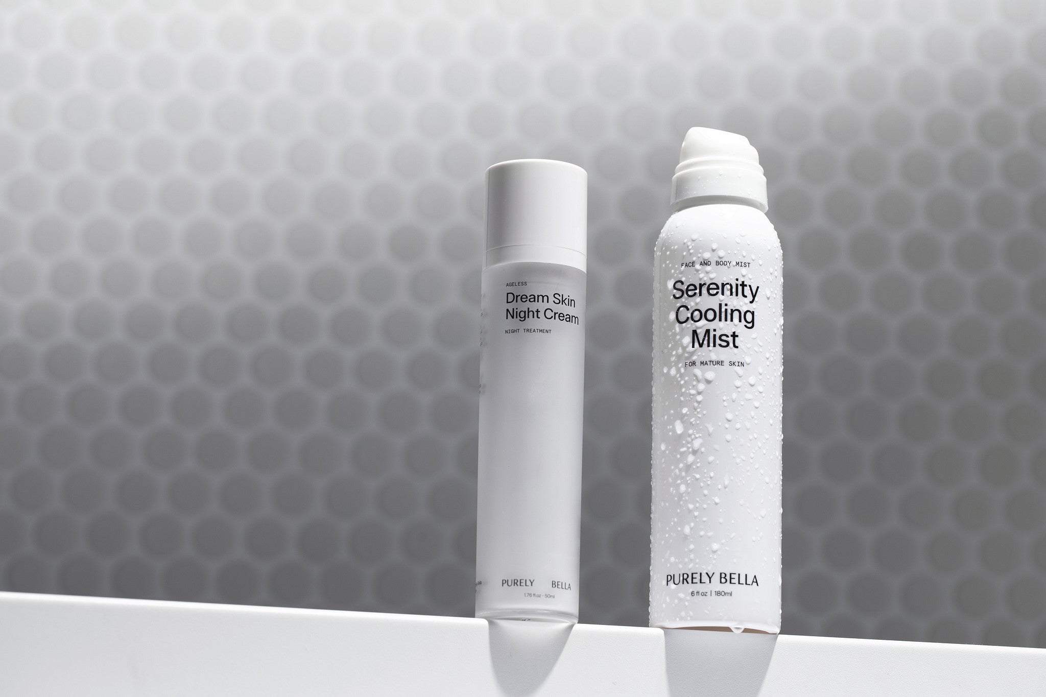 Serenity Mist and Dream Skin Night Cream displayed together on silk, perfect for the evening skincare ritual