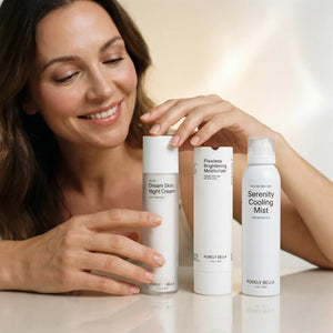 Woman holding a bottle of 'Purely Bella' skincare products with a neutral background